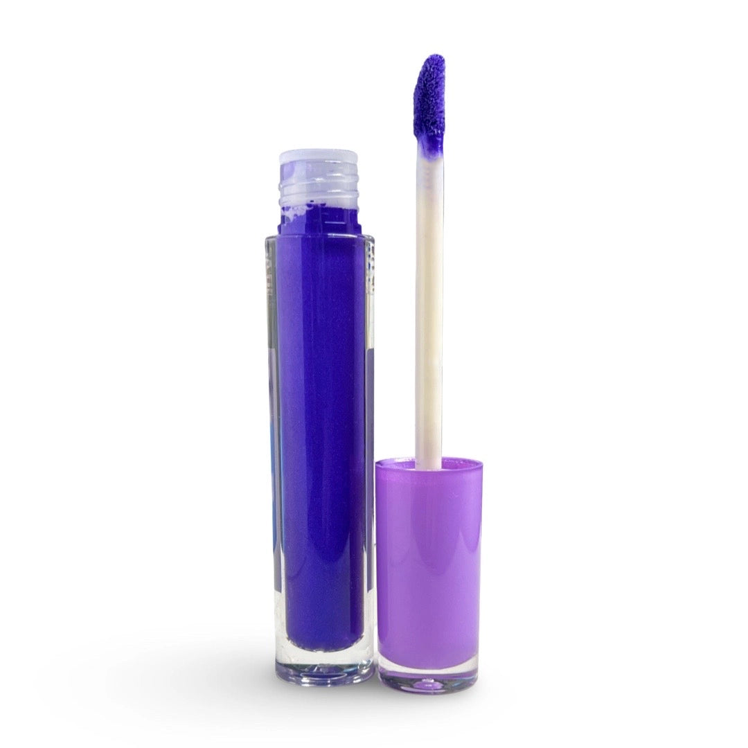 A tube of lip gloss or liquid lipstick in a vivid deep purple, shown open with the applicator wand resting beside it on a clean white background.