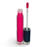 Bright pink liquid eyeshadow color in a clear cylindrical tube with its cap off, shown next to the applicator wand on a white background.