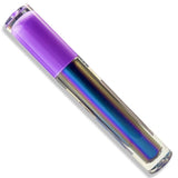 A clear cylindrical cosmetic tube with a translucent purple cap, showing an iridescent holographic liquid inside that shifts between blue, purple, and gold. The product is photographed diagonally on a clean white background.