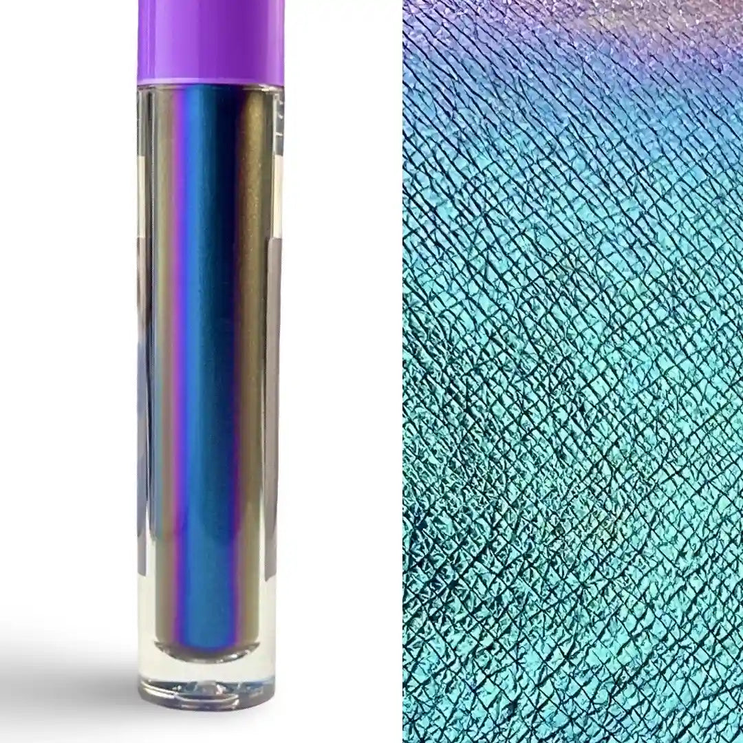 A clear cylindrical cosmetic tube with a purple cap stands on a white background beside a close-up swatch showing an iridescent holographic finish that shifts between blue, purple, and teal.
