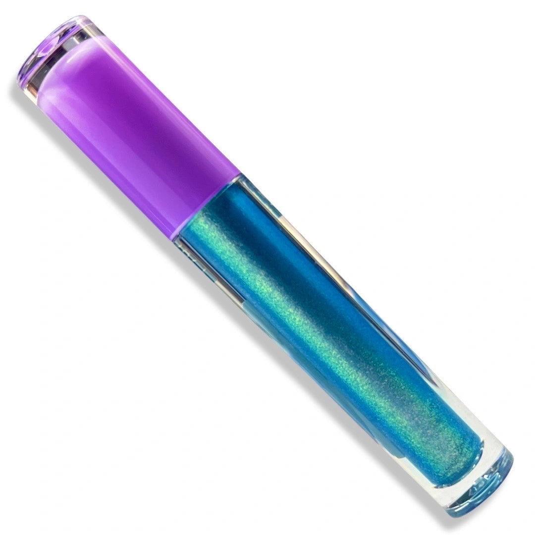A clear lip gloss tube with a translucent purple cap, showing a shimmering blue-to-teal holographic liquid inside, set against a plain white background.